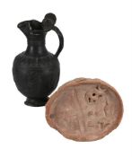 AN EGYPTIAN TERRACOTTA OFFERING TRAY, MIDDLE KINGDOM AND AN ETRUSCAN BUCCHERO OINOCHOAI