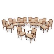 A SET OF SIXTEEN CARVED BEECH AND UPHOLSTERED CHAIRS, IN LOUIS XV STYLE, 20TH CENTURY