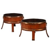 A PAIR OF WALNUT AND BRASS BOUND OVAL WINE COOLERS, CIRCA 1900