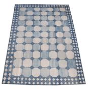 A LARGE CARPET, IN DHURRIE STYLE