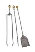 A SET OF THREE STEEL AND BRASS FIRE IRONS, 19TH CENTURY