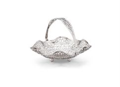 A SILVER SWING HANDLED PIERCED SHAPED CIRCULAR BASKET