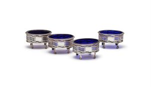 A SET OF FOUR GEORGE III SILVER OVAL SALTS