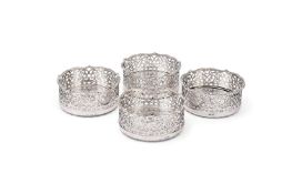 A SET OF FOUR VICTORIAN SILVER COASTERS