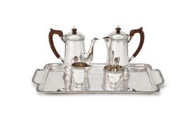A SILVER FOUR PIECE TEA AND COFFEE SERVICE AND TRAY