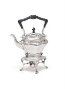 A SILVER OVAL LOBED BALUSTER KETTLE ON STAND