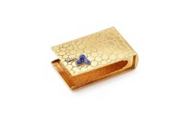 A GOLD COLOURED, SAPPHIRE AND DIAMOND SET MATCH BOX HOLDER