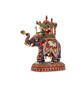 A GOLD COLOURED AND JAIPUR ENAMEL MODEL OF AN ELEPHANT