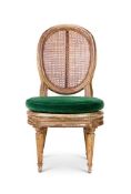 A LOUIS XVI PAINTED AND PARCEL-GILT CHAUFFEUSE, WITH A GREEN VELVET CUSHION