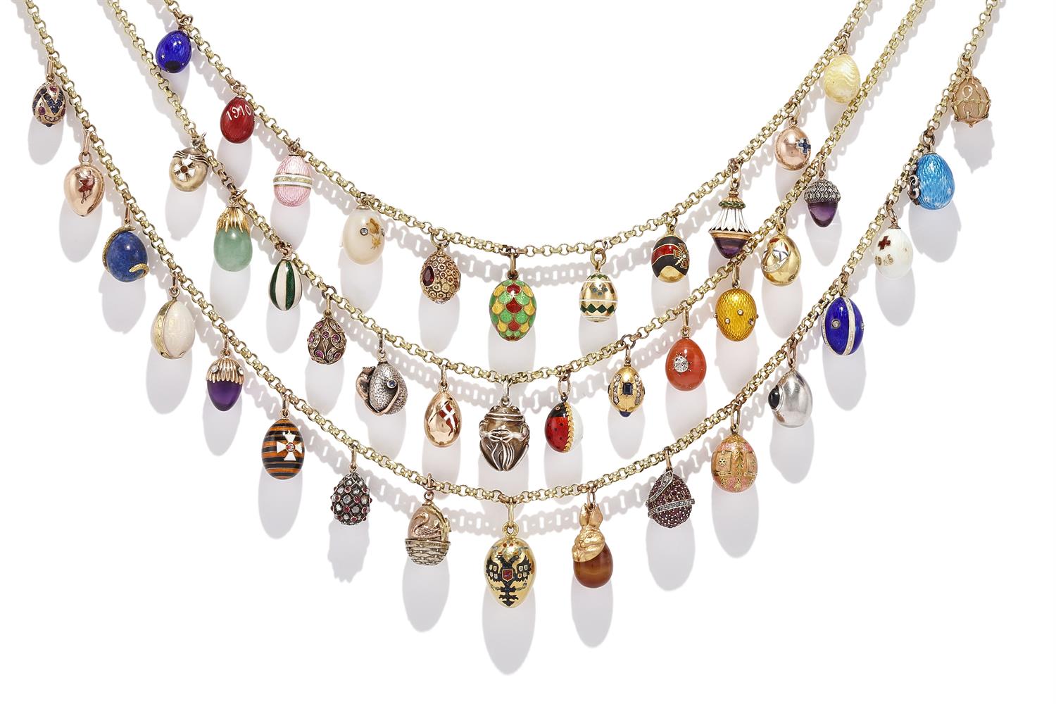 AN ENAMEL AND GEM SET EGG PENDANT NECKLACE