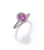 A PINK SAPPHIRE AND DIAMOND CLUSTER RING