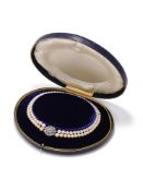 A TWO ROW CULTURED PEARL NECKLACE WITH DIAMOND CLASP