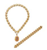 A 19TH CENTURY GOLD LOCKET NECKLACE AND SIMILAR BRACELET