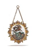 AN ENAMELLED GOLD MOUNTED ROCK CRYSTAL PENDANT