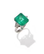 AN EMERALD AND DIAMOND RING