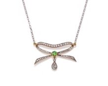 AN EARLY 20TH CENTURY AND LATER DIAMOND AND GREEN PASTE BOW PENDANT
