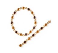 ANNABEL JONES, A CITRINE AND GARNET NECKLACE AND BRACELET SET