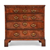 A GEORGE II FIGURED WALNUT AND FEATHERBANDED BACHELOR'S CHEST OF DRAWERS