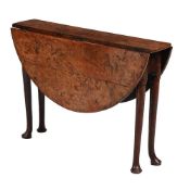 A RARE GEORGE II SOLID BURR YEW DROP LEAF DINING OR CENTRE TABLE, CIRCA 1730
