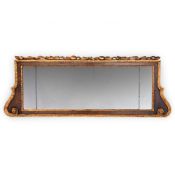 A GEORGE II WALNUT AND CARVED GILTWOOD OVERMANTLE MIRROR OR 'CHIMNEY' GLASS, CIRCA 1740