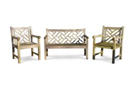 A PAIR OF HARDWOOD CHINESE TRELLIS BACK GARDEN ARMCHAIRS, LATE 20TH CENTURY