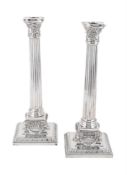 A PAIR OF VICTORIAN SILVER CORINTHIAN CANDLESTICKS