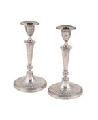 A PAIR OF EDWARDIAN SILVER CANDLESTICKS