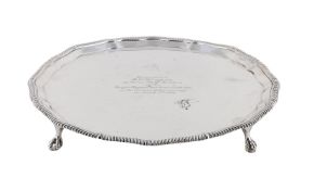 A SILVER SHAPED CIRCULAR SALVER