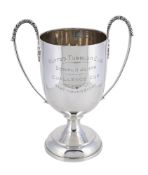 A SILVER TWIN HANDLED TROPHY CUP
