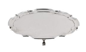 A SILVER SHAPED CIRCULAR SALVER