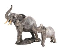 TWO SILVER FILLED MODELS OF ELEPHANTS