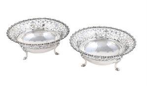 A PAIR OF SILVER CIRCULAR PIERCED DISHES