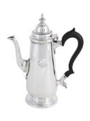 AN EDWARDIAN SILVER COFFEE POT