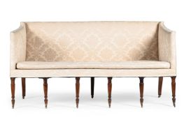 A GEORGE III MAHOGANY SETTEE, AFTER DESIGNS BY GEORGE HEPPLEWHITE, CIRCA 1800