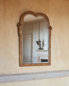 AN EARLY GEORGE III CARVED GILTWOOD MIRROR, IN THE MANNER OF BENJAMIN GOODISON, CIRCA 1760
