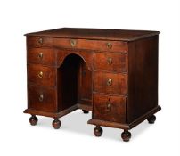 A GEORGE I OAK KNEEHOLE DESK, IN THE MANNER OF SAMUEL PEPYS, CIRCA 1720