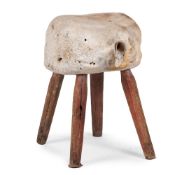 Y A STOOL, POSSIBLY CONSTRUCTED FROM A FOSSILISED VERTEBRAE, 19TH CENTURY
