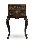 A GEORGE II BLACK LACQUER AND GILT JAPANNED BUREAU ON STAND, CIRCA 1735