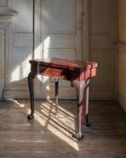 A GEORGE II CARVED MAHOGANY FOLDING TEA TABLE, PROBABLY IRISH, CIRCA 1750