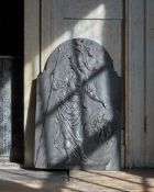 A CARVED AND EBONISED CHIMNEY BOARD, 18TH OR EARLY 19TH CENTURY