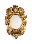 A SMALL ITALIAN CARVED GILTWOOD MIRROR, SECOND QUARTER 18TH CENTURY