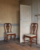A PAIR OF GEORGE II CARVED WALNUT CHAIRS, MID 18TH CENTURY