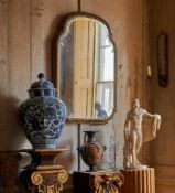 AN UNUSUAL QUEEN ANNE CARVED GILTWOOD MIRROR, CIRCA 1710