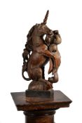 A CARVED ELM UNICORN, 17TH CENTURY
