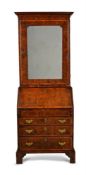 A GEORGE II BURR YEW AND WALNUT CROSSBANDED BUREAU BOOKCASE, CIRCA 1740