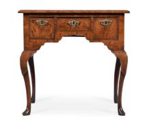 A GEORGE II WALNUT AND FEATHERBANDED SIDE TABLE OR LOWBOY, CIRCA 1740