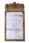 A GEORGE I CARVED GILTWOOD AND GESSO MIRROR, IN THE MANNER OF JOHN BELCHIER, CIRCA 1720