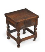 A RARE CHARLES I OAK BOX SEAT JOINT STOOL, REPUTEDLY FROM HADDON HALL, DERBYSHIRE, CIRCA 1640