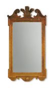 A GEORGE II CARVED GILTWOOD MIRROR, IN THE MANNER OF JOHN BELCHIER, CIRCA 1730