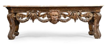 A LARGE CARVED GILTWOOD AND GESSO CONSOLE TABLE, AFTER DESIGNS BY WILLIAM KENT